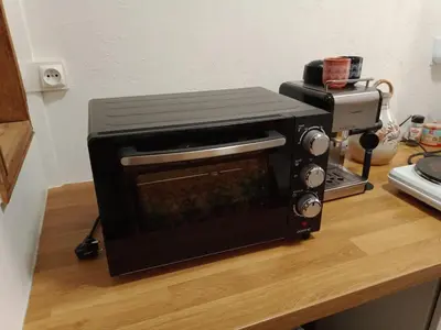 a toaster oven sitting on top of a counter at Cadre de rêve mais vous faites le ménage- very good prices but you have to clea-n th-e flat in Cannes