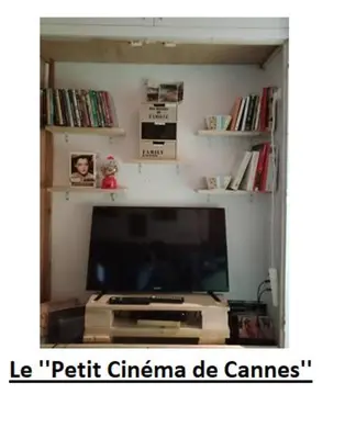 a living room with a flat screen tv and a entertainment center at Cadre de rêve mais vous faites le ménage- very good prices but you have to clea-n th-e flat in Cannes