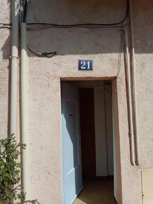 a doorway to a building with a sign on it at Cadre de rêve mais vous faites le ménage- very good prices but you have to clea-n th-e flat in Cannes