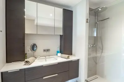 a bathroom with a sink and a shower at Cannes Croisette Superbe 3P front de mer in Cannes
