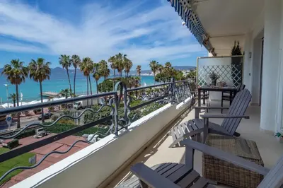 a balcony with chairs and a view of the ocean at Cannes Croisette Superbe 3P front de mer in Cannes