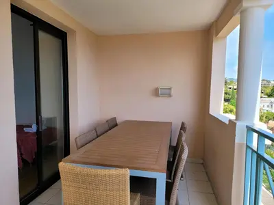 a dining room table and chairs on a balcony at T2 + CABINE VILLA FRANCIA in Cannes
