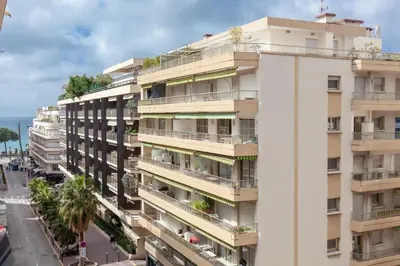 an apartment building with balconies and a street at Modern & cozy 150m from the Croisette in Cannes