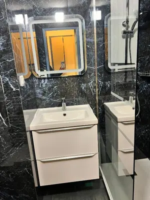 a bathroom with a sink and a mirror at Magnifique T2 Climatisation - Grande Terrasse, Piscine et apercu Mer in Cannes