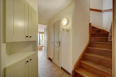 a hallway with stairs leading to a home at IMMOGROOM - 2BR - sea view - Swimming pool - Terrace - Parking - AC - Wifi in Cannes