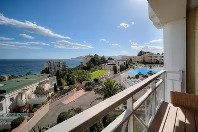 a balcony with a view of the ocean at IMMOGROOM - 2BR - sea view - Swimming pool - Terrace - Parking - AC - Wifi in Cannes