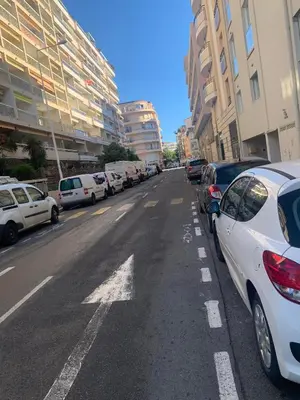 a street with cars parked on the side of the road at Branly 4, by Welcome to Cannes in Cannes