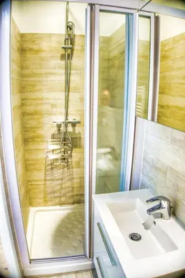 a bathroom with a shower and a sink at Cannes charming studio 50 meters from the beach !! in Cannes