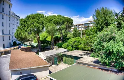 an overhead view of a tennis court in a park at Cannes charming studio 50 meters from the beach !! in Cannes
