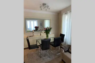 a dining room with a table and chairs at AnaZa Appartement in Cannes