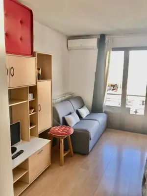 a room with two beds and a window with a view at Idéal congrès Studio 33m2 à 4 minutes du Palais in Cannes