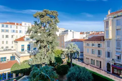 a view of a city with buildings and a tree at Idéal congrès Studio 33m2 à 4 minutes du Palais in Cannes