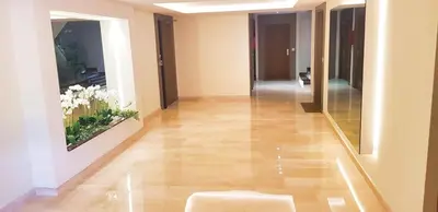 a hallway of a building with wood floors and a painting at Ref BEAUSITE - Palmes d'Or Properties in Cannes