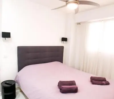 a bedroom with a large bed with two towels on it at 2 pièces Luxueux en face du Martinez et Croisette in Cannes