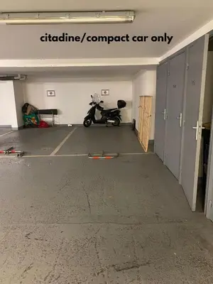 a parking garage with a scooter parked in it at Moderne 2 pièces TERRASSE PARKING, Clémenceau A1B230 in Cannes
