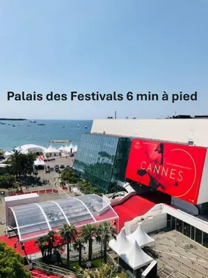 a picture of a resort with a pool and the ocean at Moderne 2 pièces TERRASSE PARKING, Clémenceau A1B230 in Cannes