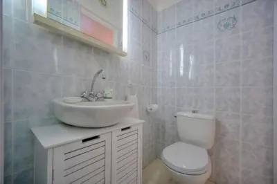a bathroom with a white sink and a toilet at Duplex 2 chambres TERRASSE, MEYNADIER- FORVILLE A2B103 in Cannes