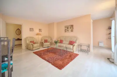 a living room with two chairs and a table at Duplex 2 chambres TERRASSE, MEYNADIER- FORVILLE A2B103 in Cannes