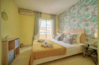 a bedroom with a bed with two stuffed animals on it at Duplex 2 chambres TERRASSE, MEYNADIER- FORVILLE A2B103 in Cannes