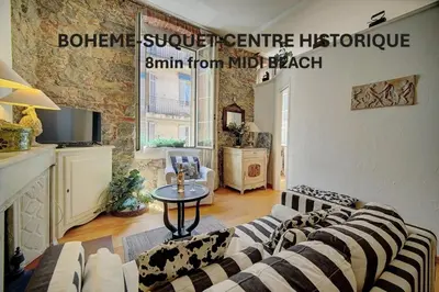 a living room with a couch and a fireplace at Bohème 2 chambres SUQUET- CENTRE HISTORIQUE A2B159 in Cannes