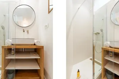a bathroom with a sink and a shower at IMMOGROOM - Bright flat - near shops - CONGRESSBEACHES in Cannes