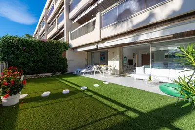 a backyard with a lawn with golf balls on it at 2-Br Luxury Apartment with Sea View and Pool in Cannes