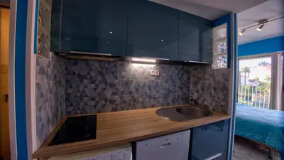 a small kitchen with a sink in a room at 3 StarsStudio54 23 Ave Laugier100m Plages Mistral in Cannes