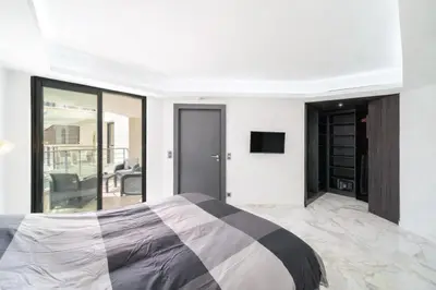 a bathroom with a sink and a tub and a mirror at Carlton Riviera Cannes in Cannes