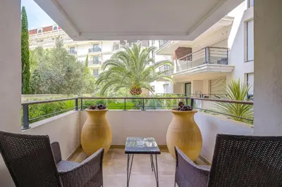 a living room with a couch and a table at Carlton Riviera Cannes in Cannes