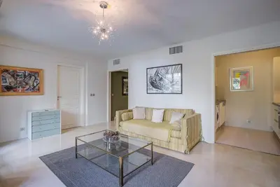 a living room with a couch and a table at Carlton Riviera Cannes in Cannes