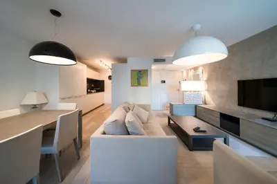 a bedroom with a large bed and a large window at Carlton Riviera Cannes in Cannes
