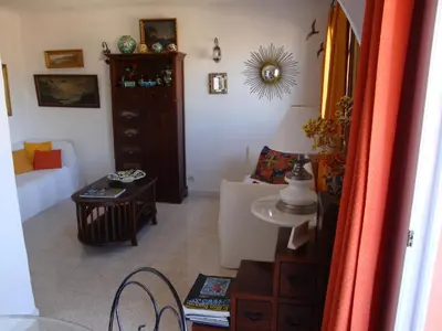 a living room with a couch and a table at les terrasses du Suquet in Cannes