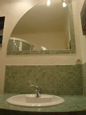 a sink in a bathroom with a mirror at les terrasses du Suquet in Cannes