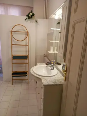 a bathroom with a sink and a towel rack at Appartement hyper-centre Croisette Cannes in Cannes