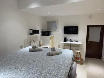 a bedroom with a bed with two towels on it at Le Barri By SCLS Locations in Cannes