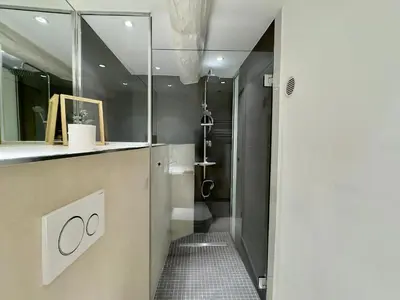 a bathroom with a shower and a sink and a toilet at Le Barri By SCLS Locations in Cannes