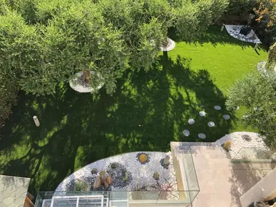 an overhead view of a garden with trees and a lawn at Beautiful Apartment 2mn walking distance from La Croisette and The Beach in Cannes