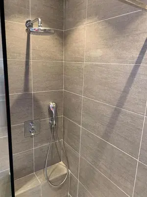 a bathroom with a shower with a glass door at Beautiful Apartment 2mn walking distance from La Croisette and The Beach in Cannes