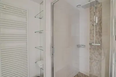 a bathroom with a shower with a glass door at C066-Luxurious apartment with sea view - Cannes in Cannes