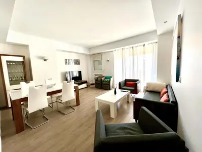 a living room with a couch and a table at C066-Luxurious apartment with sea view - Cannes in Cannes