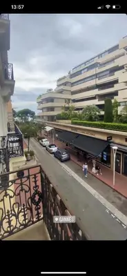 a view of a building with cars on a balcony at Croisette Palais festival 5 minutes , 170 m2 moderne spacious in Cannes