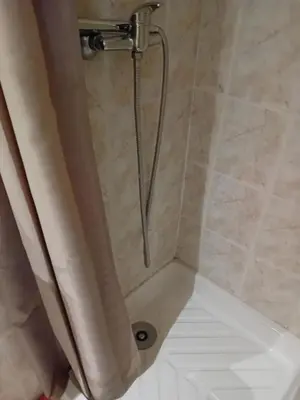 a shower with a shower head in a bathroom at Private room full furnished in cannes in Cannes
