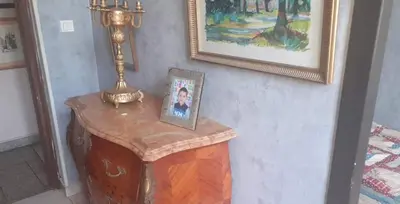 a table with a picture on it with a lamp on it at Private room full furnished in cannes in Cannes