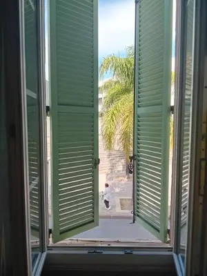 an open window with a view of the beach at Private room full furnished in cannes in Cannes