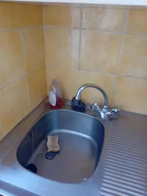 a sink with a faucet in a bathroom at Private room full furnished in cannes in Cannes