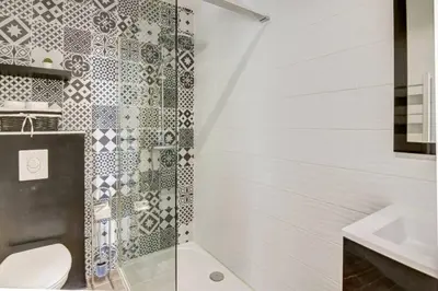 a bathroom with a shower and a toilet and a sink at Palais Apartment in Cannes