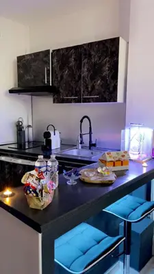 a kitchen with a counter with two plates of food on it at Nuit privée in Cannes