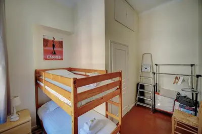 a bedroom with two bunk beds and a ladder at IMMOGROOM - Fully equipped -AC- near Palais des Festivals in Cannes