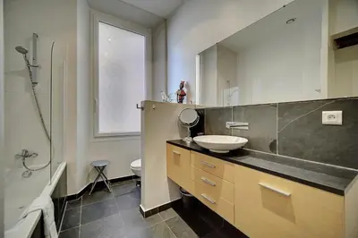 a bathroom with a sink and a toilet and a shower at IMMOGROOM - Fully equipped -AC- near Palais des Festivals in Cannes