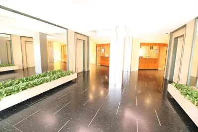 a hallway with plants in the middle of a building at 1 Bedroom Henri IV on the Croisette 240 in Cannes
